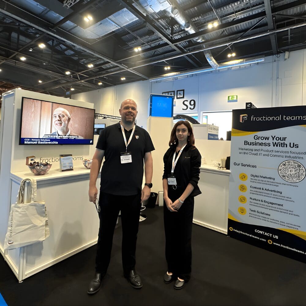 man and woman at an event stand